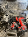 Skil 12 volt dual source drill with batteries and charger station. Turned on