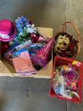 Assorted decorations. Masks, hats, table clothes, eared necklaces with shot, glasses, artificial