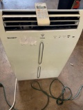 Sharp Plasmacluster portable air conditioner with remote, turned on