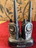 Midland walkie-talkies and charger, turned on
