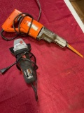 Chicago Saw & Drill Master angle grinder both turned on