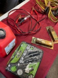 Jumper cables, gasoline container, coil spring boosters, flat tire repair kit. 6 pieces