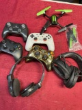Assorted controllers, head phones, etc. 7 pieces