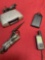 Grouping of 4 electronics, Clock radio, Magellan GPS 310, Ubiquitti unit, Nekteck Solar battery.