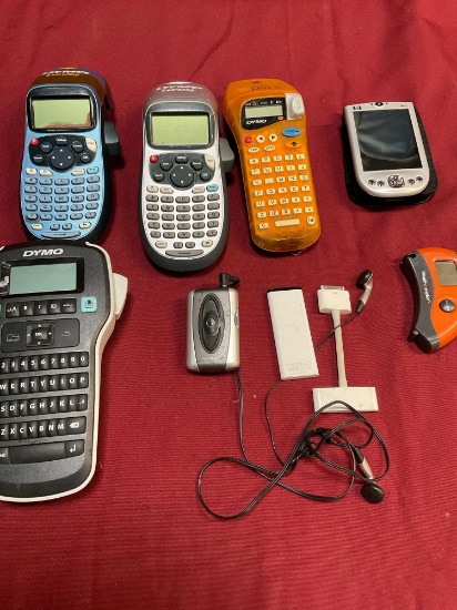 Grouping of assorted label makers, Listen Up device, Apple Remote, HP Ipac, etc. No cords, 9pcs.