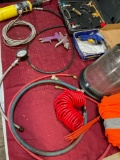 Assorted items. Gauge, hoses, air gun, helmet, vest, etc. 12 pieces