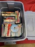 DVDs , VHS & CDs. Over 30 pieces includes Rubbermaid container