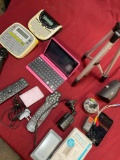 Assorted items. Cameras, remote controls, labelers, chargers, etc . 16 pieces