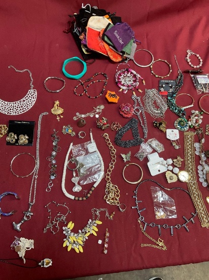 Assorted custom jewelry, and jewelry bags.77 pieces
