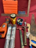 Assorted items. Empty boxes, hammers, saws, Black & Decker saw no battery, etc. 14 pieces