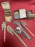 Assorted wrenches, drill bit boxes empty or with missing drill bits, Whitney hand punch. 7 pieces
