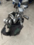 Hunter golf bag & Grouping of assorted golf clubs. 20 clubs