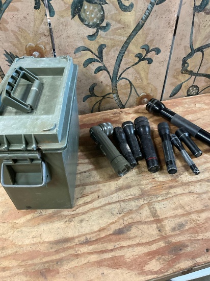 Plastic ammo box and assorted flashlights. 9 pieces
