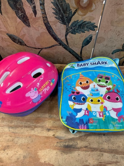 Peppa Pig holds helmet & Baby Shark back pack
