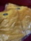 New, individually packed, small, men's, large, gold jersey. 25 pieces