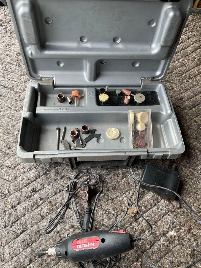 Drill Master drill with accessories, turned on
