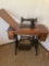 Vintage Singer sewing machine with cabinet, placard stamped AC490314, works
