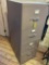 Four drawer metal file cabinet with key