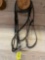 Eggbutt snaffle with leather headstall and braided English reins