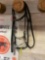 Full cheek snaffle with leather headstall including keepers and English braided reins