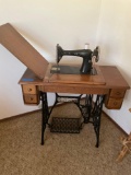 Vintage Singer sewing machine with cabinet, placard stamped AC490314, works