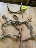 Assorted shank bits and a curved mullen mouthpiece