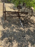 Antique hay rake, used as yard art