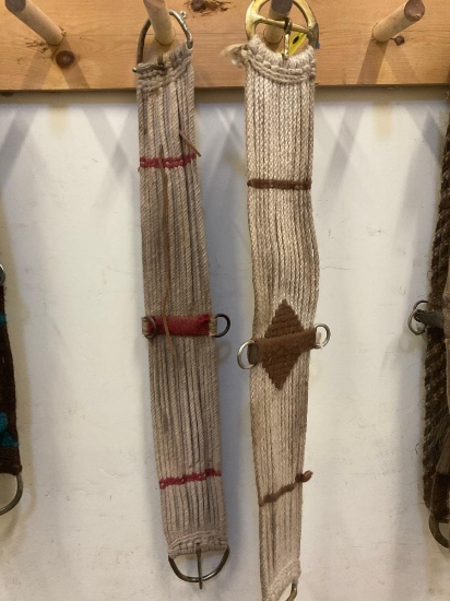 34" horse cinch, one has brass buckles. 2 pieces