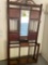 Antique wood hall cabinet with mirror, coat hooks, umbrella area and cubby for gloves