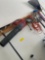 Assorted tools. Complete contents on wall. Work light, saw, rake, blower, electrical cord, etc