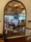 Arched wood frame mirror. 52