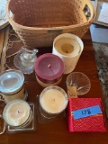 Lot of assorted candles/holders and basket. 11 pieces