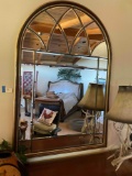 Arched wood frame mirror. 52