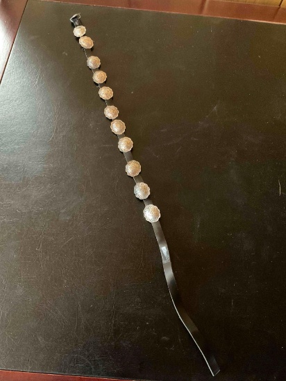 Leather hat band 27" long with 11 sterling silver conchos (1" each concho).
