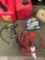 Two gallon gasoline container,strap, cables, etc. 6 pieces
