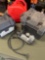 2 gallon gasoline containers, battery boxes, Husky inflator turned on. 4 pieces