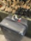 Samsonite rolling luggage and assorted boots & shoes. 7 pairs