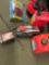 1 & 2 gallon gasoline containers, battery filler, opened package light kit, etc. 8 pieces