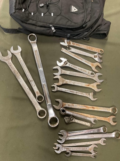Reebok backpack and assorted wrenches.19 pieces