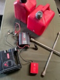 Two gallon gasoline containers, power converter, wrench, inverter, inflator. 6 pieces