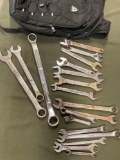 Reebok backpack and assorted wrenches.19 pieces