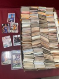 Thousands of collectable cards. Majority are baseball. Some are bent, damaged. Attend preview for