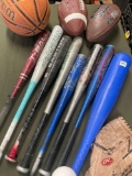 Assorted bats, balls, Renegade left handed baseball glove. 12 pieces