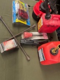 1 & 2 gallon gasoline containers, battery filler, opened package light kit, etc. 8 pieces