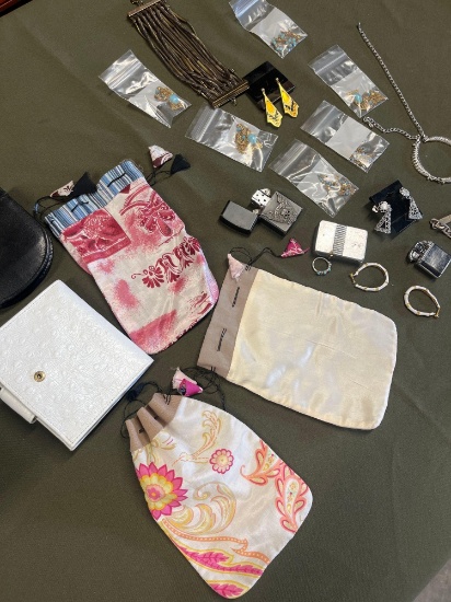 Assorted costume jewelry, jewelry bags, wallets, lighters. 21 pieces