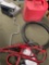 2 1/2 gasoline container, car stereos, wheel cover, wrench, jumper cables. 6 pieces