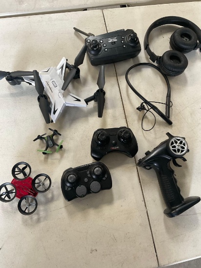 Assorted controllers, drones, headsets. 9 pieces