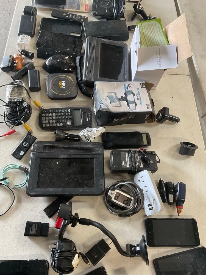 Assorted items. Chargers, adapters, controls, battery tester, mounts, etc. 48 pieces