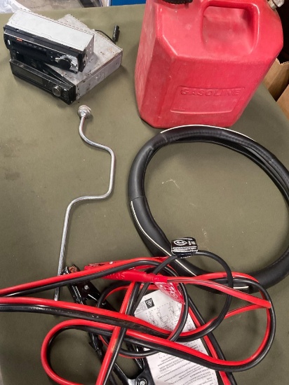 2 1/2 gasoline container, car stereos, wheel cover, wrench, jumper cables. 6 pieces