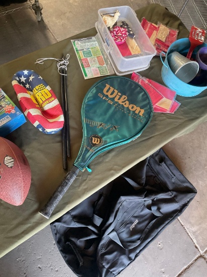 Assorted items. Jansport equipment rolling bag, balls, racket, etc